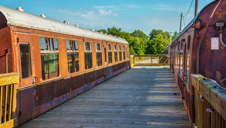 Passenger cars and old caboose stored at  historic Standish Michigan railroad depotの写真素材