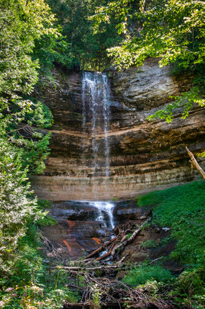 Tall water flowing from Munising Falls Munising township Michiganの写真素材