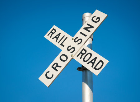 Roadway railroad crossing sign for  oncoming trains warningの写真素材