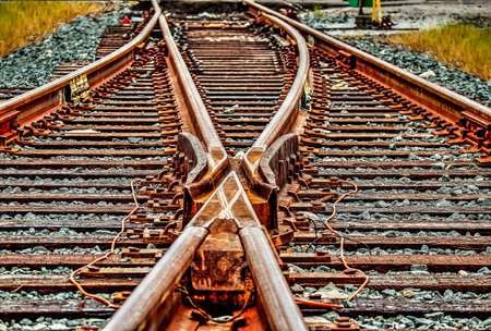 Railroad track switch frog to direction or mergingの写真素材
