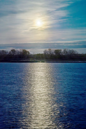 Shimmering river as sunrises east of Detroit in early springの写真素材