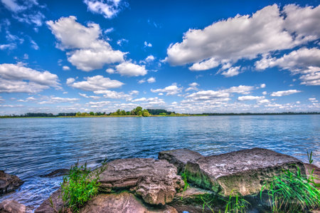 Rocky Detroit River Shore line under Summer Skyの写真素材