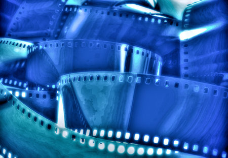 A close-up artistic depiction of coiled blue film rolls. The image captures the cinematic essence and nostalgic feel associated with the analog film era, showcasing vivid hues and a mesmerizing aesthetic.の写真素材