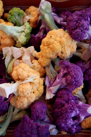 organic purple yellow white green cauliflower heads and crownsの写真素材