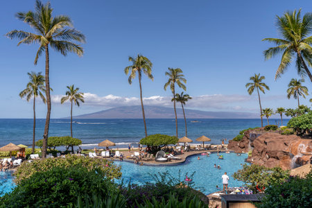 A view of the luxurious relaxation pool and Pacific Ocean at the Hyatt Regency Maui Resort and Spa in Lahaina, Maui, Hawaii.のeditorial素材