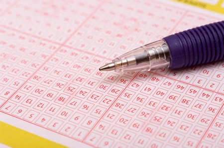 a pen is on a lottery ticketの写真素材