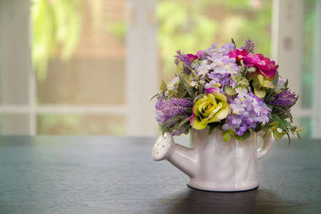 Decoration artificial flower in the pot on table - vintage effect styleの写真素材