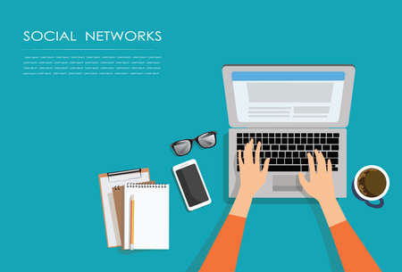 Female hands typing text on the laptop keyboard and using social networks for communication. Top view of people working with computer at the work desk.tecnology conceptのイラスト素材