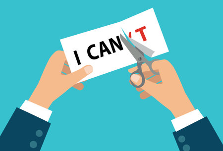 man hands using scissors cut the word I can't text. Confidence, courage, risk and motivation...