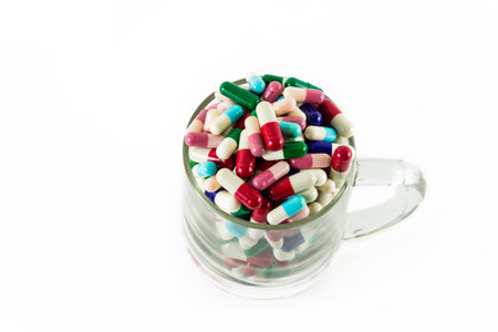 medicine drug capsule in cup isolated