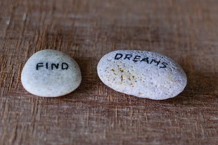 Write dream & Smile  wording engraved on stones.の写真素材