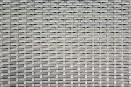 close up of synthetic rattan weave texture as used on outdoor garden furniture