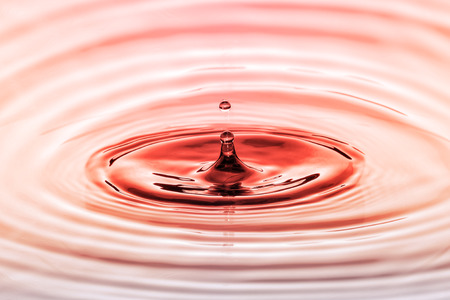 Water drop close up with concentric ripplesの写真素材