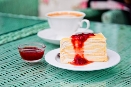 crepe cake and strawberry blueberry sauceの写真素材