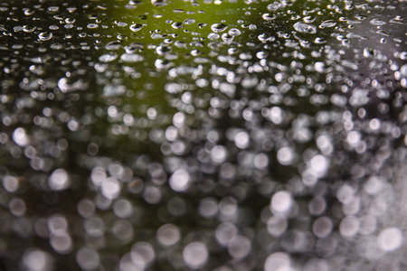 Water drops on glass  with bokeh effect の写真素材