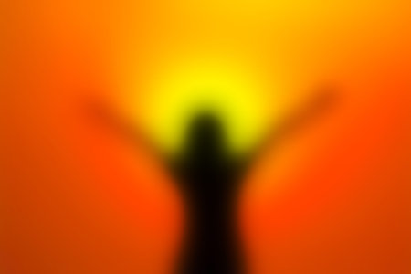 blurred of Silhouette of young woman on sunset concert for success relaxの写真素材