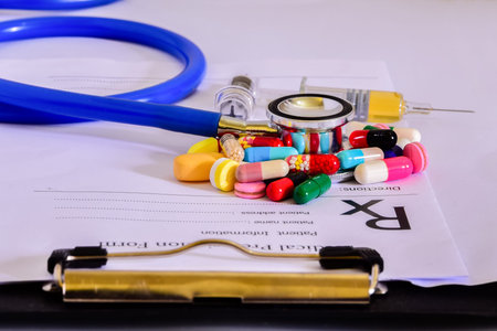 Medical Pharmacist prescription stuff form - blank prescription and pills,Stethoscope on table