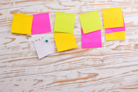 Post it, sticky note on wood board, empty space for text
