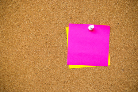 close up of post it, sticky note on cork board, empty space for text