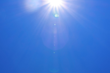 Real Shining sun flare at clear blue skyの写真素材