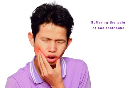 man have  toothache and mouth ulcer on white background,symptoms of toothaches typically involve some kind of ache or pain in the jaws or gumsの写真素材