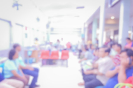 blurred hospital background,A lot of unidentified people and patient in hospital waiting medicine or doctorの写真素材