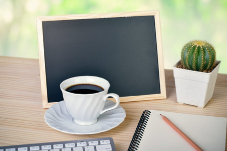 coffee cup with blackboard notepad on table. with copy space