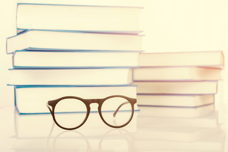 Eyeglasses with stack of book retro tone