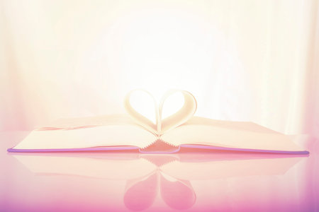 Heart shape of book pages. Soft focus retro tone for background