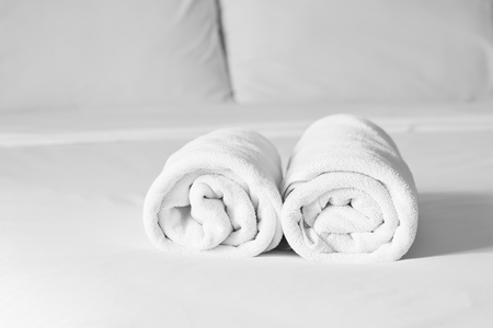 towels on bed sheet decorative at home stayの写真素材