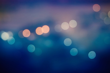 defocused night city lights bokeh vintage tone backgroundの写真素材