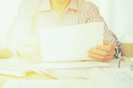 Businessman analyze the charts and graphs showing the results startup success conceptの写真素材