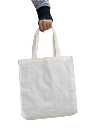 woman hand holding white cotton fabric bag on isolate background ,save world conceptの写真素材