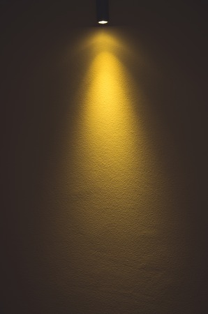 Light on yellow wall backgroundの写真素材