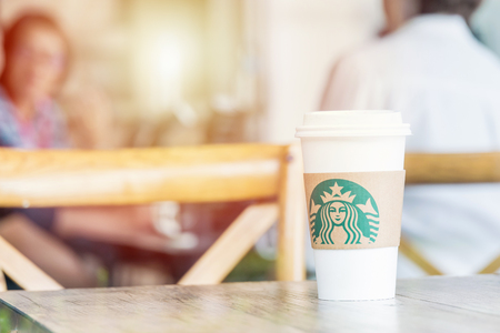 BANGKOK ,THAILAND,1 JULY 2017 : A Cup of Starbucks hot beverage coffee on the table in the Starbucks drive thru shop. Starbucks is the worlds largest coffeehouse companyのeditorial素材
