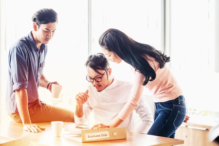 Teamwork concept. Startup Business plan and discussing with digital and paperwork data organization meeting conceptの写真素材