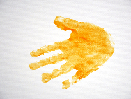 child hand print on white paper background.の写真素材