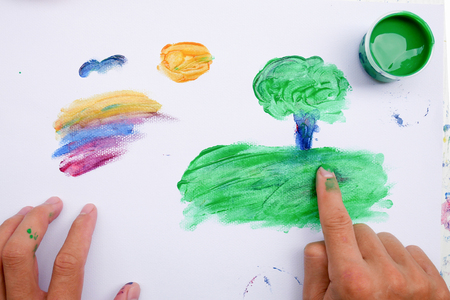 Painting with hand and colorful paints children development concept.の写真素材