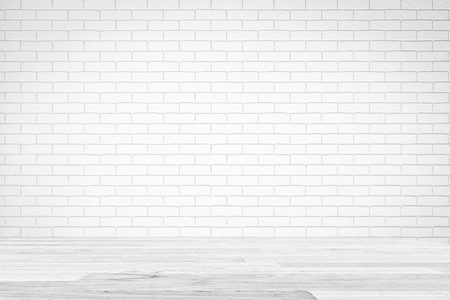 White Brick Wall Texture with white wooden table , Empty Abstract Background for Presentations for Text Composition art image, website, magazine or graphic design.の写真素材