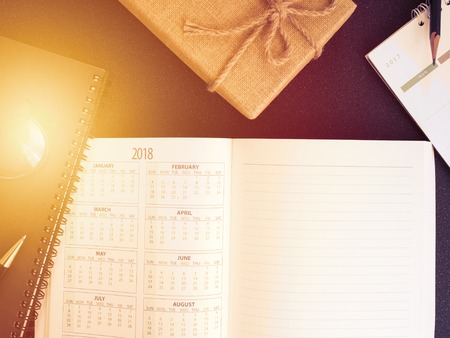 blank planning notebook and pen on desk use us organizer schedule life or business planner concept.の写真素材