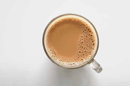 Hot coffee cup on white table background with copy space for put text or object top view minimal styleの写真素材