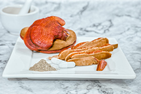 Capsule and powder of Lingzhi Mushroom Ganoderma Lucidum on for herbal medicine Real Mushrooms
