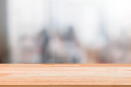 Blank Wood Table Top on blurred people background with bokeh or coffee cafe background for montage...