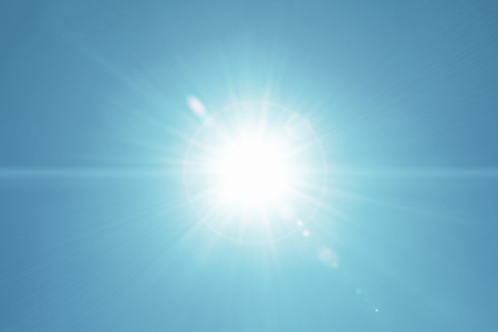Sunlight Motion Lens flare on Clear on Real blue sky backgroundの写真素材