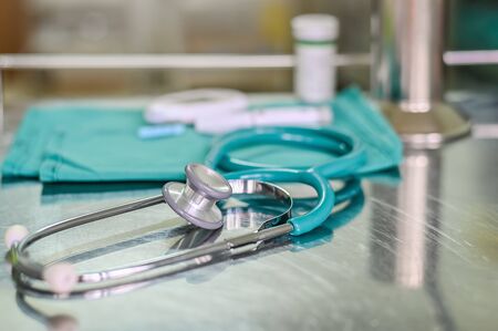 Stethoscope and medical equipment tool on treatment table in hospital. Shallow dof on stethoscope, medicine backgrounds conceptの写真素材