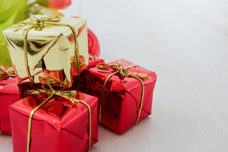 little red gift box decorative on white wood table background.