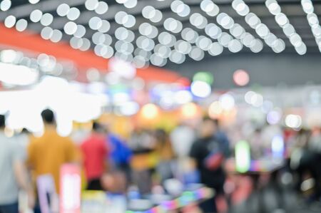 Blurred exhibit showcase background unspecific people Shop in grand sale fair and showcase advertisement backgroundの写真素材