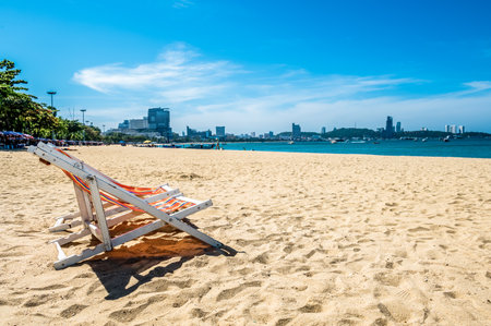 Beach chair at tropical beach in pattaya thailand with beautiful turquoise ocean water, white sand and blue skyの写真素材