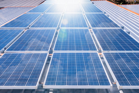 Solar panels on rooftop with sun reflect light power for alternative energy photovoltaic safe energy. power from nature sun power solar cell generatorの写真素材