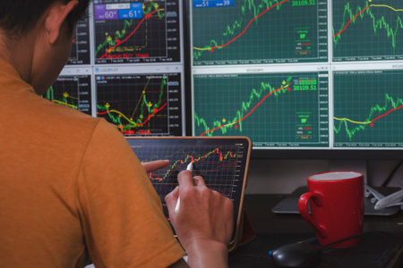 Man analysis forex concurrency stock graph market for trading forex to profit by order sell or buy...